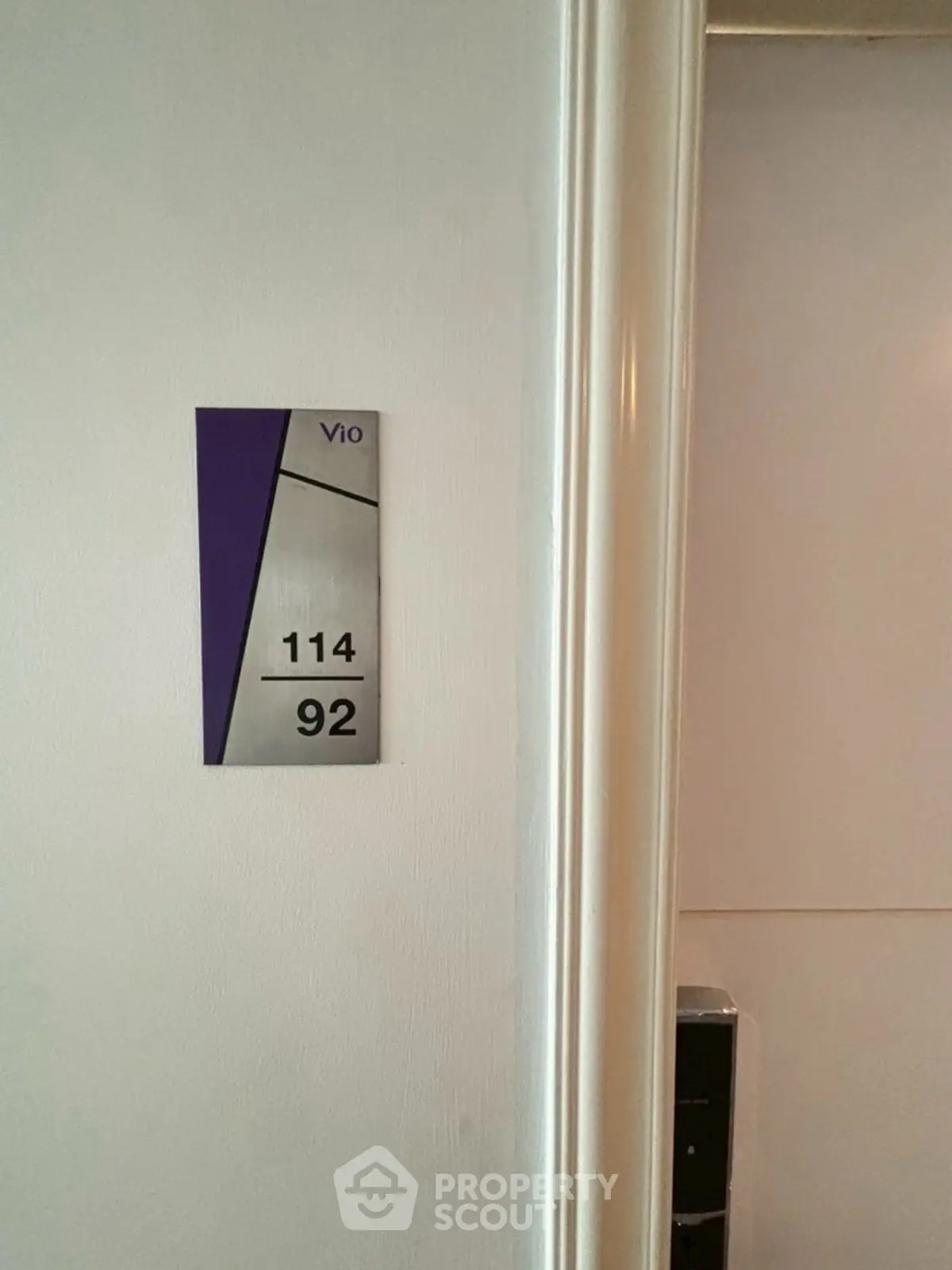 Modern apartment hallway with stylish room number signage