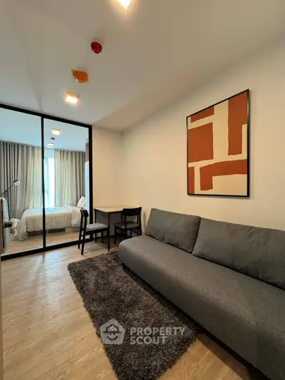 Modern apartment interior with stylish living room and cozy bedroom view