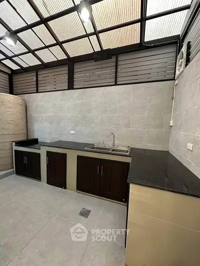 Modern kitchen with sleek countertops and ample storage in a stylish open layout.