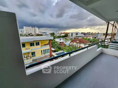 Spacious balcony with city view, perfect for relaxing and enjoying the skyline.