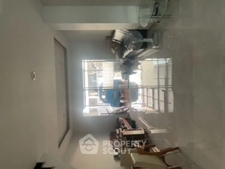 Spacious living room with modern furniture and large windows