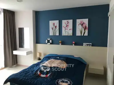 Charming bedroom with stylish decor and cozy bedding in modern apartment.