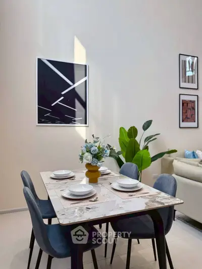 Modern dining area with elegant table setting and stylish decor