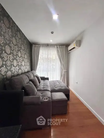 Stylish living room with elegant wallpaper and cozy sectional sofa
