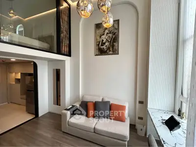 Modern loft-style living room with high ceilings and elegant decor