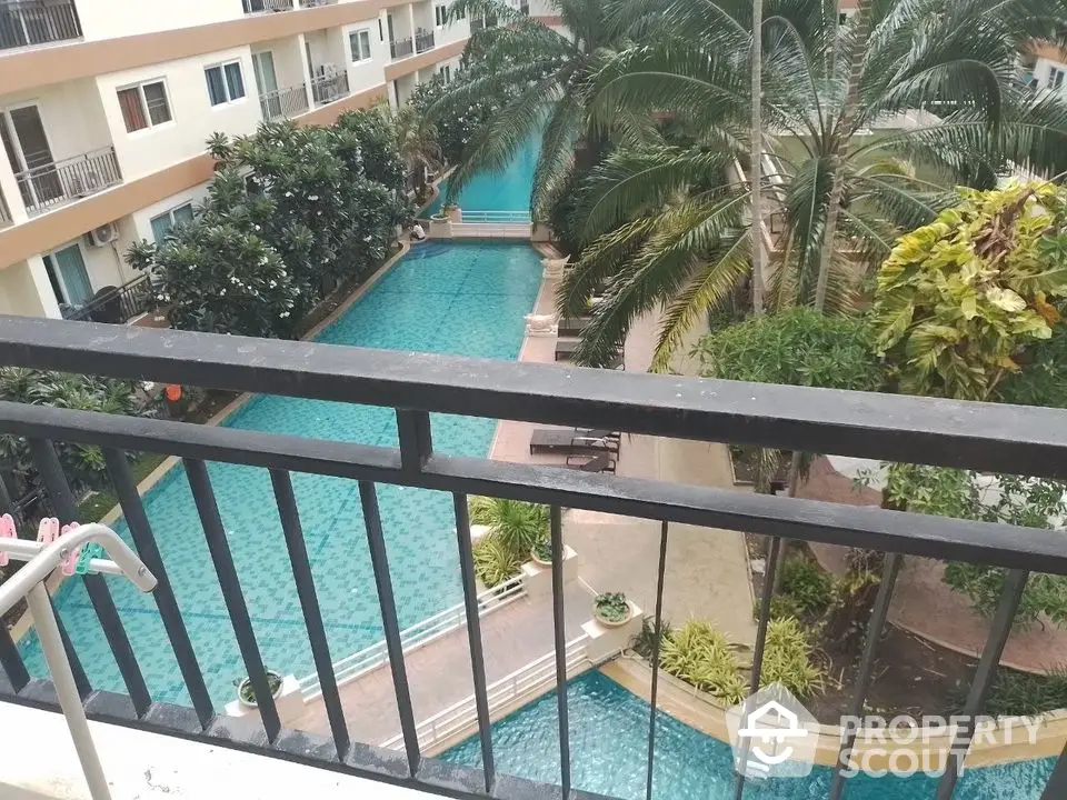 Stunning pool view from balcony in modern apartment complex