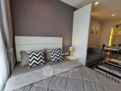 Modern bedroom with stylish decor and cozy ambiance in a contemporary apartment.