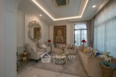 Luxurious living room with elegant decor and plush seating in a sophisticated home.