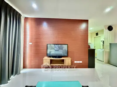 Modern living room with wall-mounted TV and sleek wooden paneling