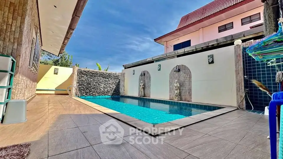 Luxurious private pool area with modern design and elegant stone accents, perfect for relaxation and entertainment.