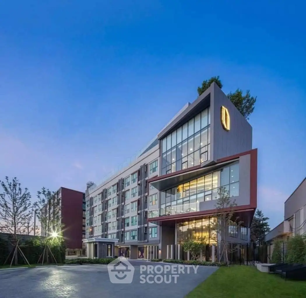Modern architectural building with sleek design and large windows, perfect for urban living.