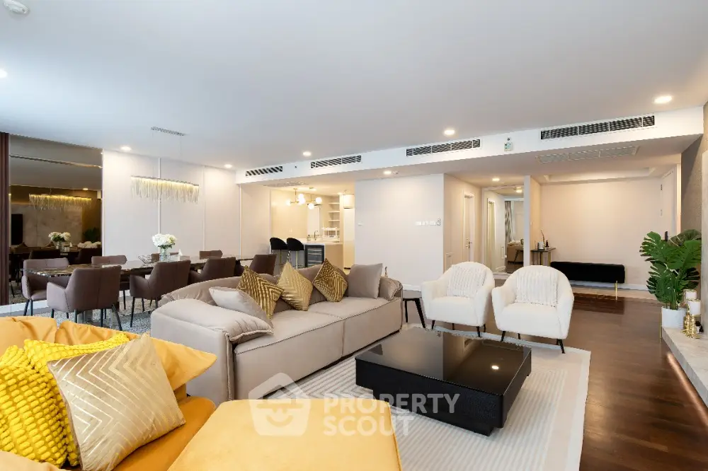 Luxurious open-plan living room with elegant decor and spacious dining area