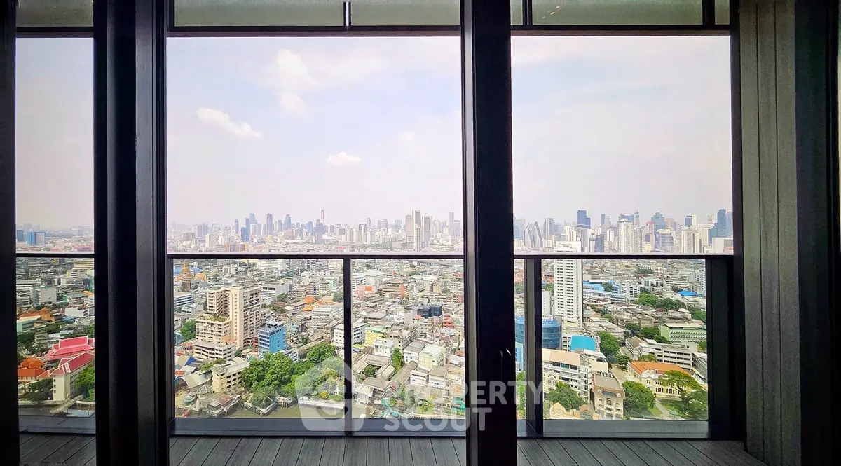 Stunning cityscape view from a high-rise balcony with expansive skyline.