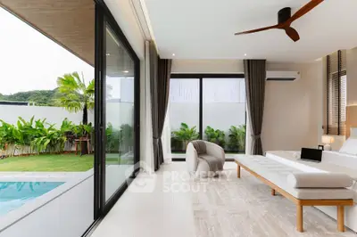 Luxurious modern living room with pool view and elegant decor