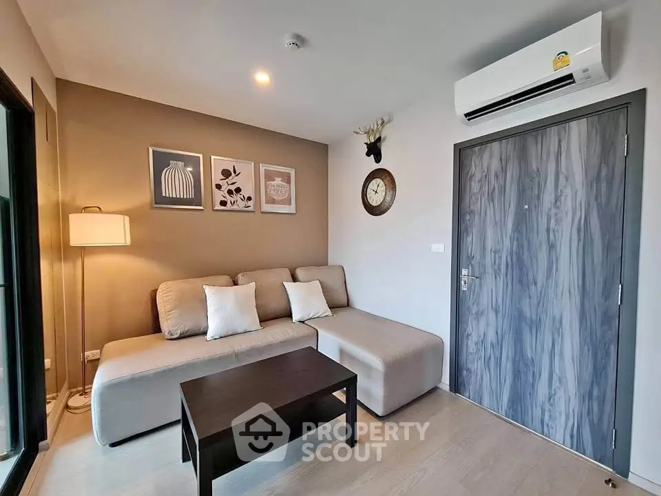 Modern living room with stylish decor and comfortable seating in a cozy apartment.