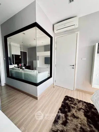 Modern apartment interior with stylish decor and air conditioning, featuring a cozy living area and sleek design.