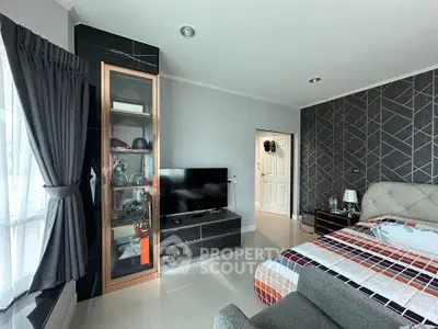Modern bedroom with stylish decor and natural light