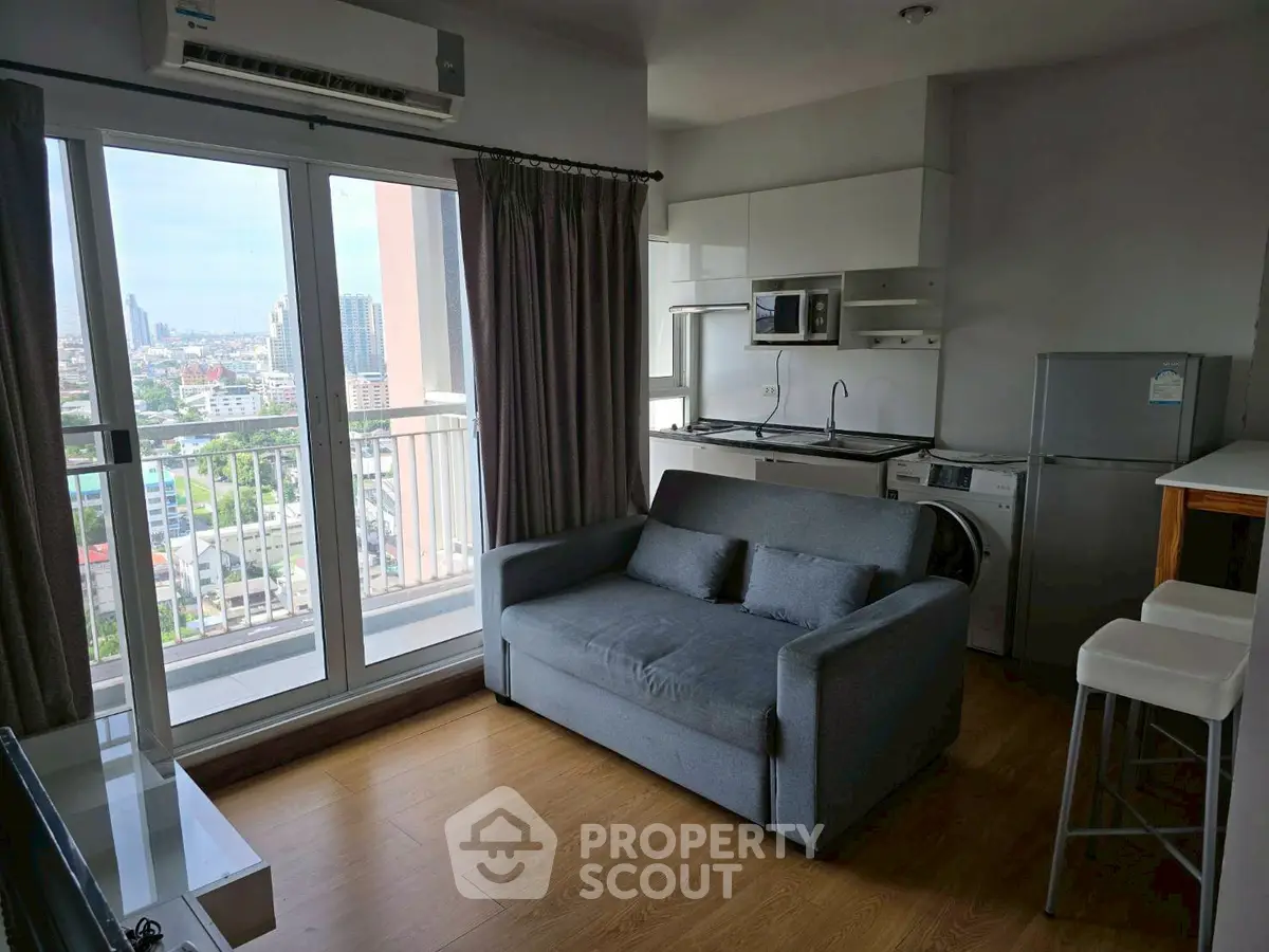 Modern living room with balcony view in high-rise apartment