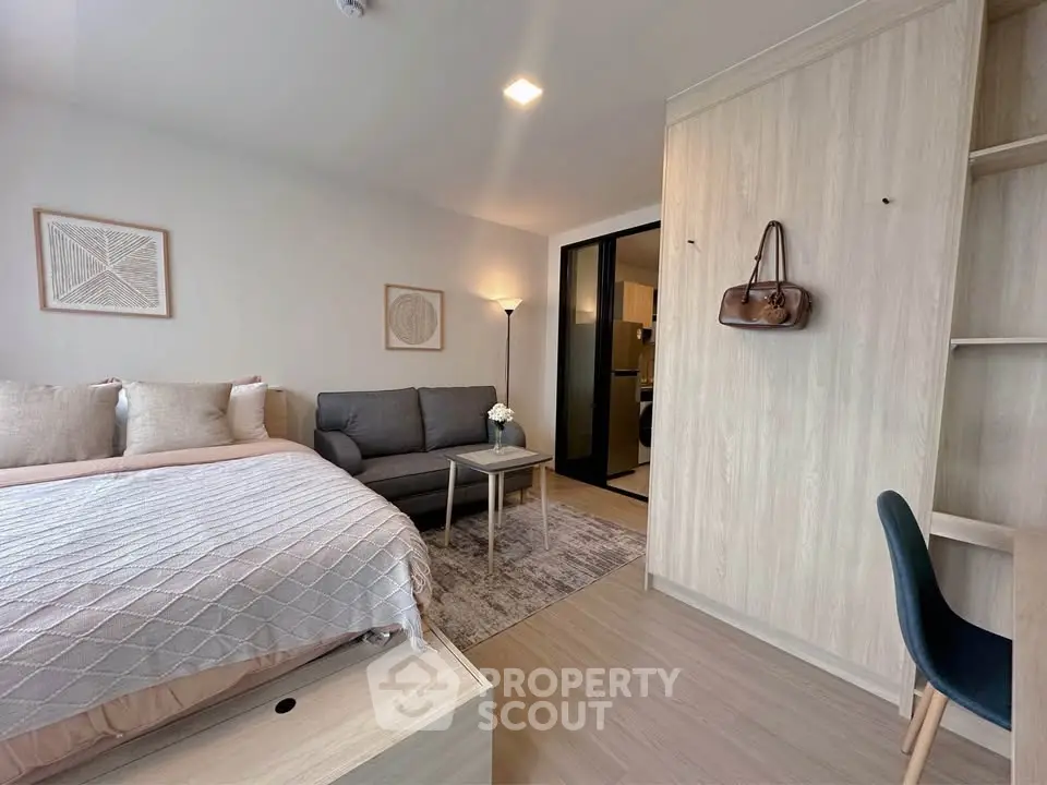 Modern studio apartment with cozy living area and stylish decor