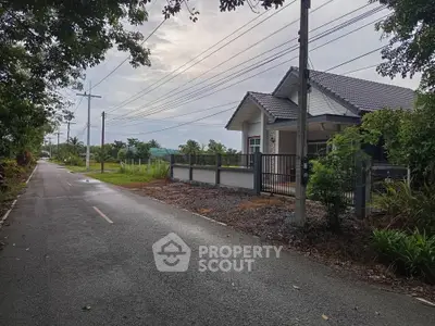 Charming suburban house with modern design and lush greenery, perfect for tranquil living.