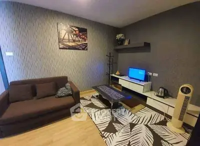 Modern living room with stylish decor and cozy furniture in a contemporary apartment.