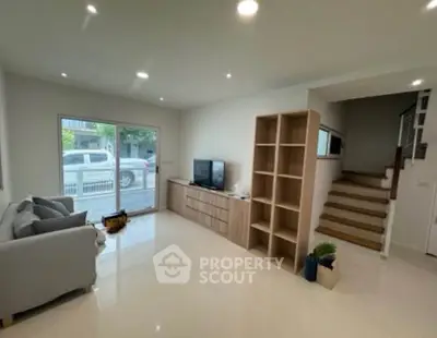 Spacious modern living room with sleek design and natural light