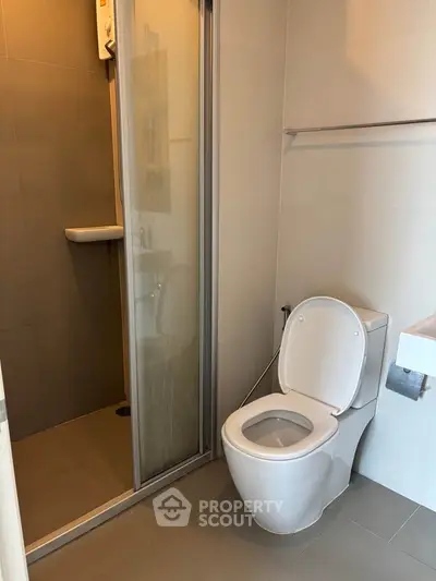 Modern bathroom with shower and toilet in sleek design