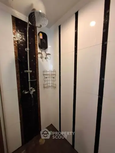 Modern bathroom with sleek shower design and elegant tile accents