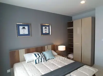 Modern bedroom with stylish decor and ample storage space