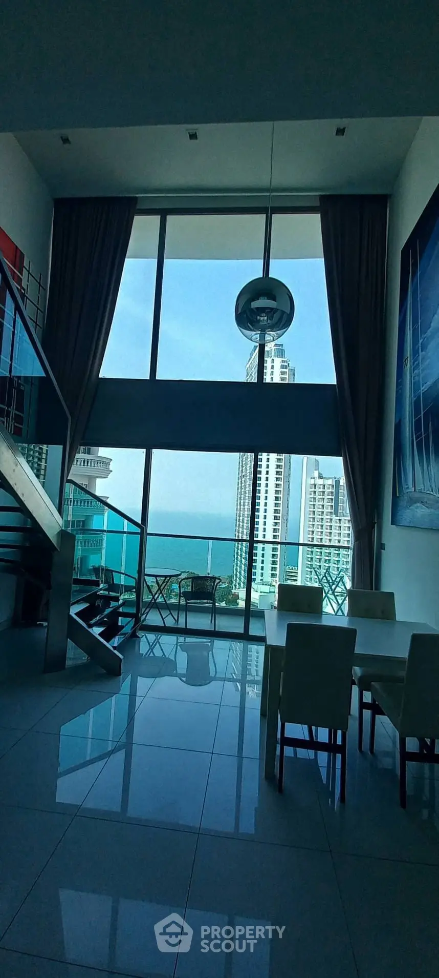 Luxurious high-rise apartment with stunning ocean view and modern interior design.