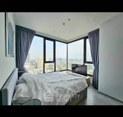 Luxurious bedroom with panoramic city view and modern decor