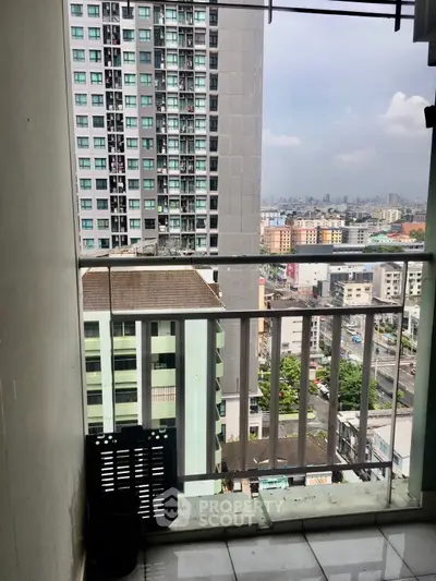 High-rise balcony with cityscape view, perfect for urban living enthusiasts.