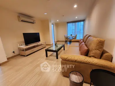 Spacious living room with modern furniture and natural light