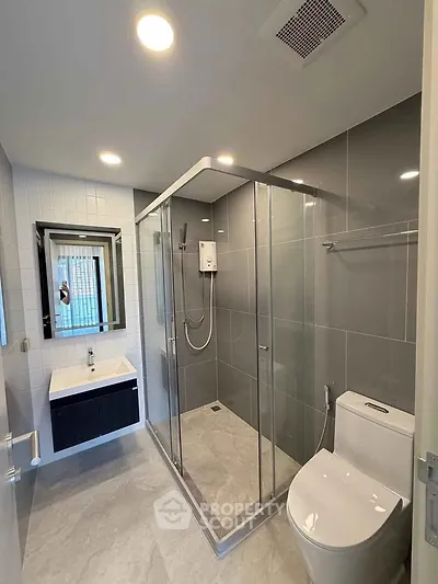 Modern bathroom with sleek shower enclosure and stylish fixtures