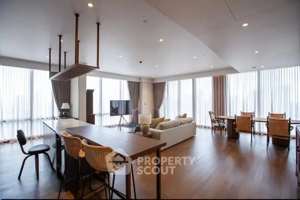 Spacious modern living room with open kitchen and large windows