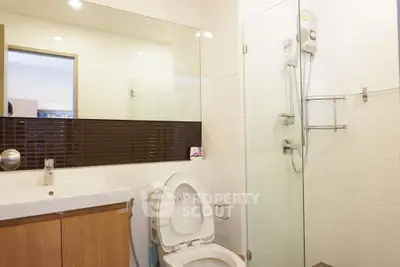 Modern bathroom with glass shower and sleek fixtures