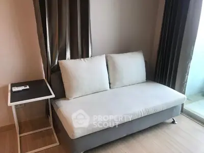 Modern living room with sleek sofa and elegant curtains