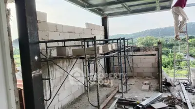 Under-construction building with scaffolding and scenic view