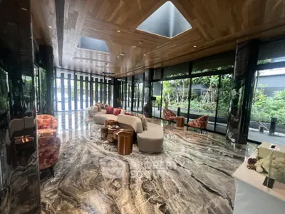Luxurious modern living room with marble floors and garden view