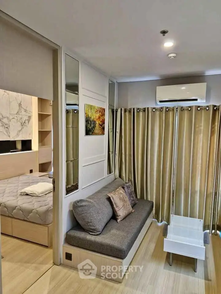 Modern living room with cozy sofa and elegant decor in a stylish apartment.