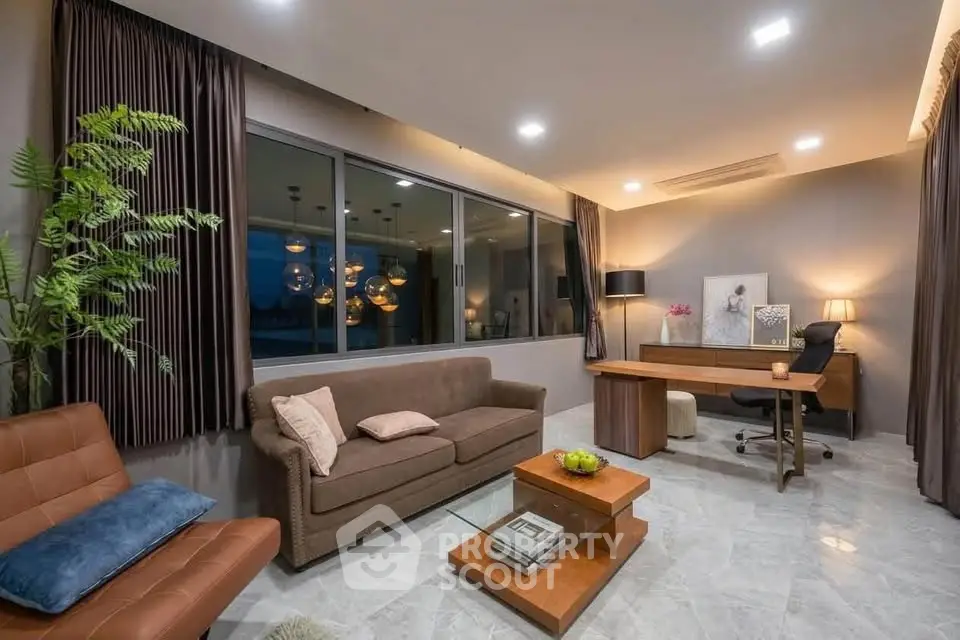 Spacious modern living room with elegant decor and large windows