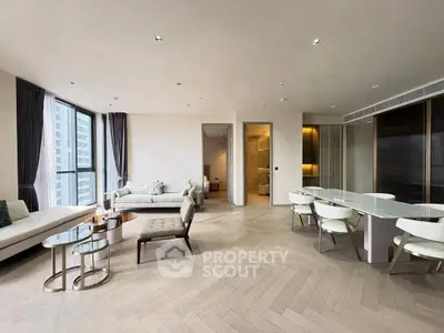 Luxurious modern living room with elegant dining area and large windows offering city views.
