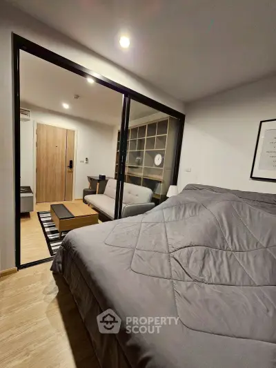 Modern studio apartment with cozy bedroom and stylish living area