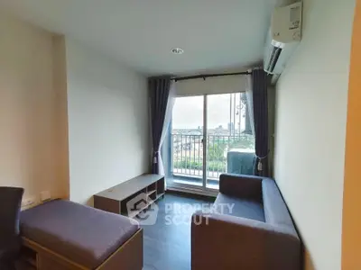 Cozy living room with balcony view in modern apartment