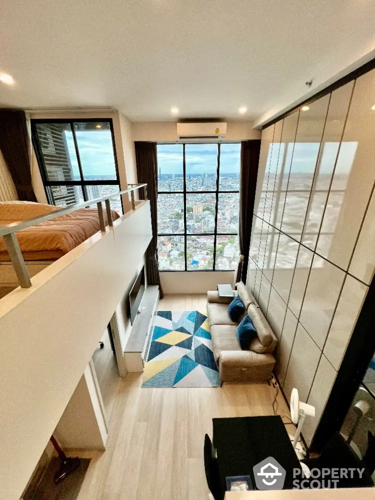 Stunning loft apartment with floor-to-ceiling windows and city view, featuring modern decor and spacious living area.