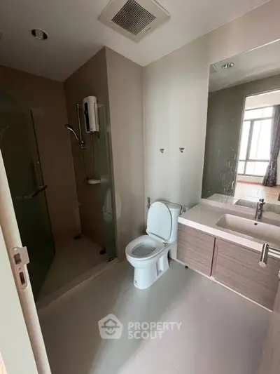 Modern bathroom with shower and sleek fixtures in contemporary apartment