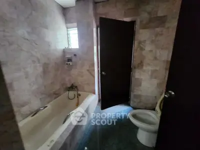 Cozy bathroom with bathtub and modern fixtures in a stylish home.