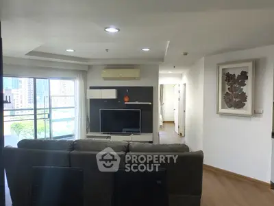 Spacious living room with modern decor and city view