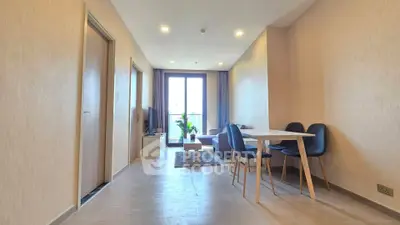 Modern living room with dining area and natural light