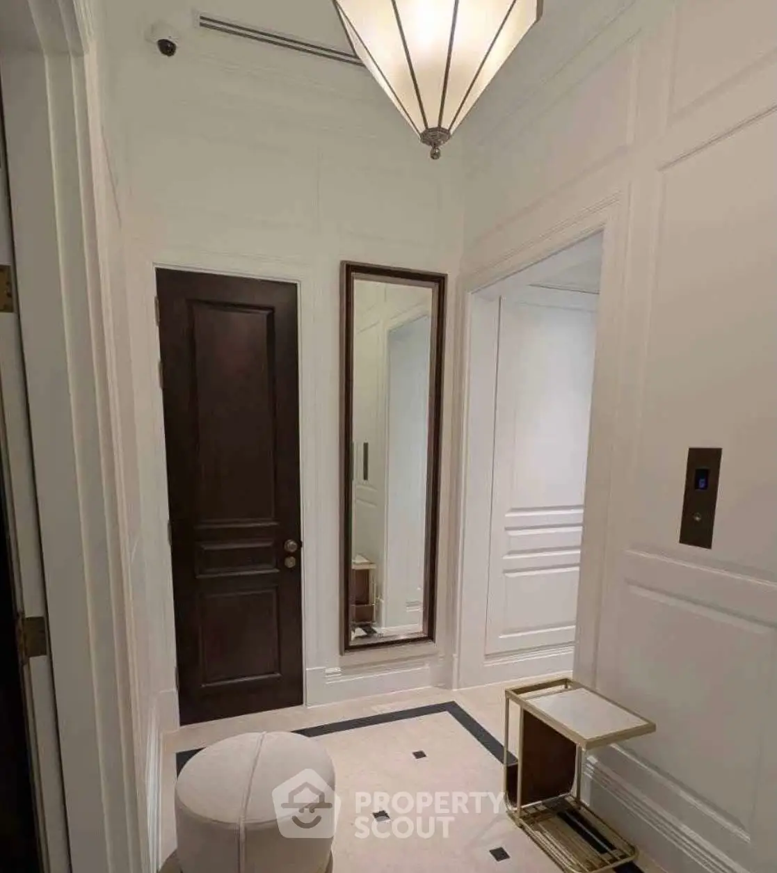 Elegant elevator lobby with modern lighting and stylish decor